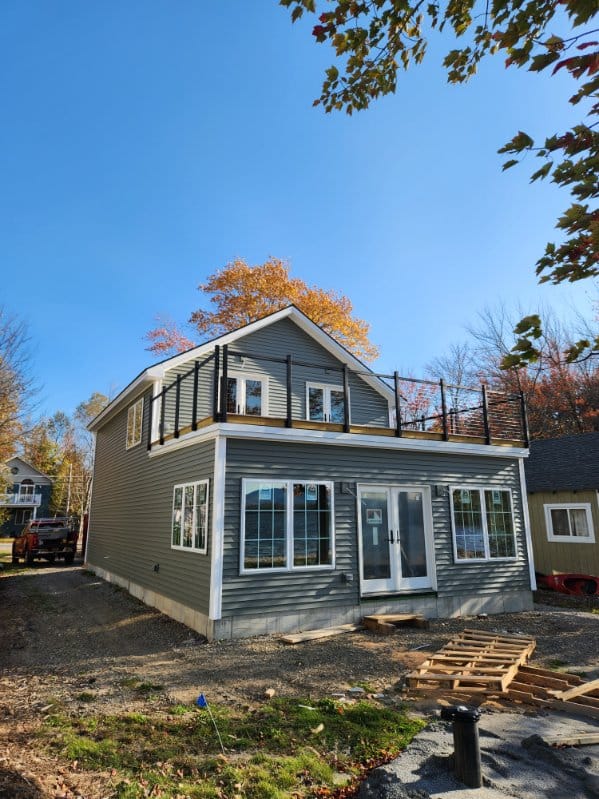 J. L. Adler Carpentry - Convential Frame Camp on a Pond